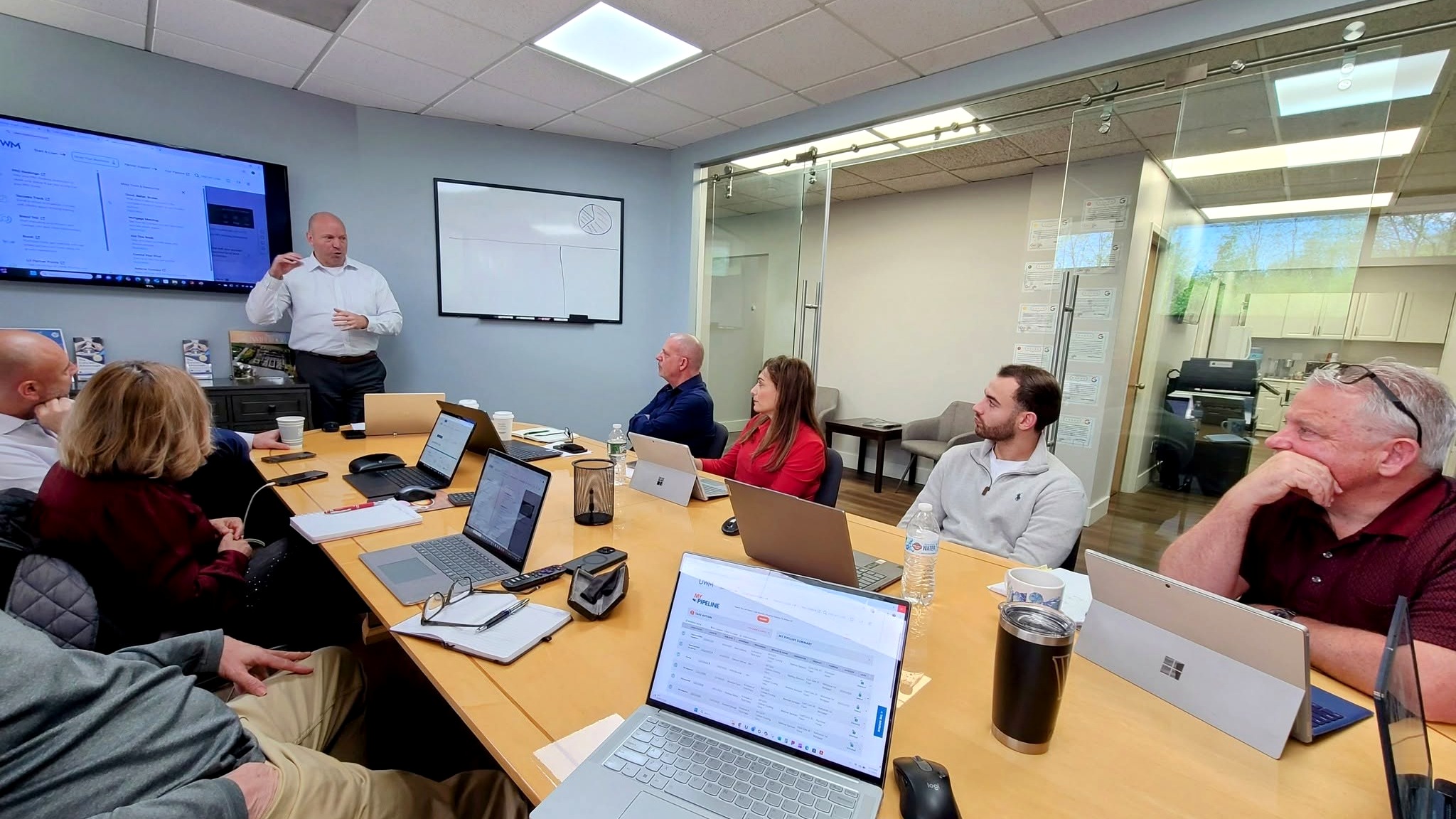The Coltrain Mortgage team in a strategy session at the Hauppauge office