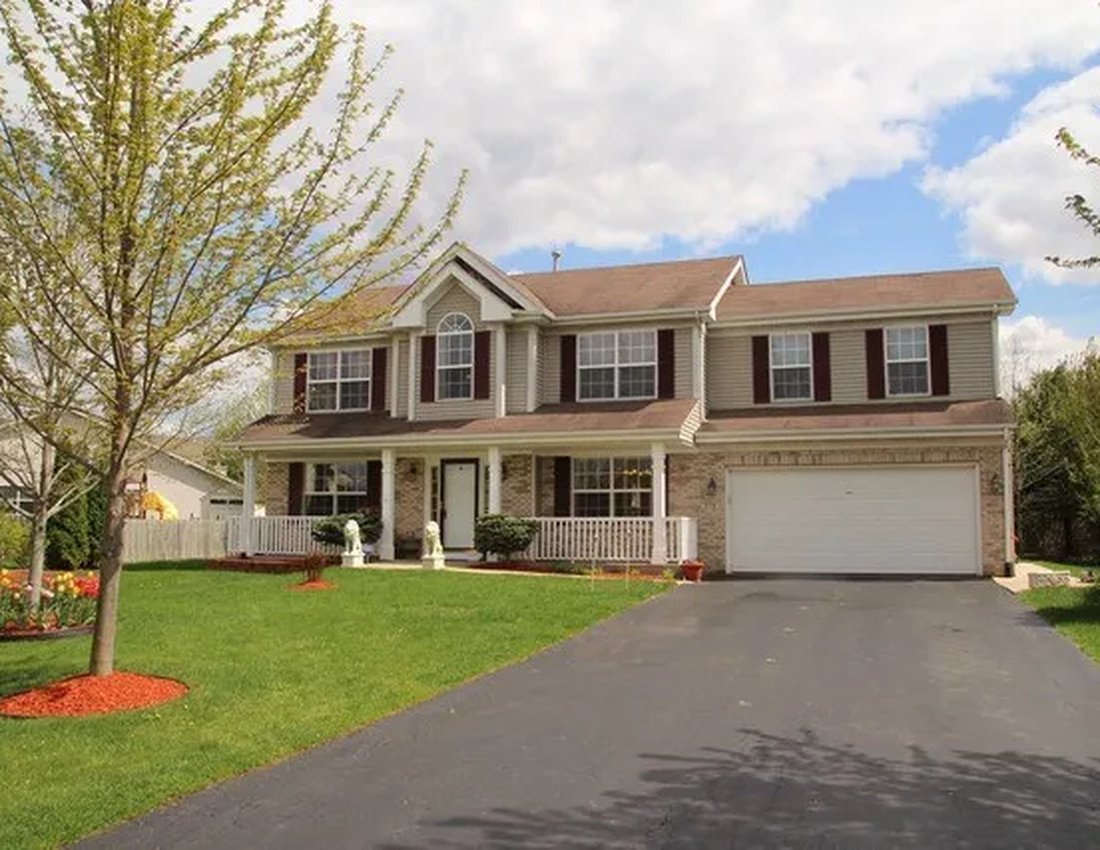 Suburban two-story home representing the equity homeowners can access with a digital HELOC