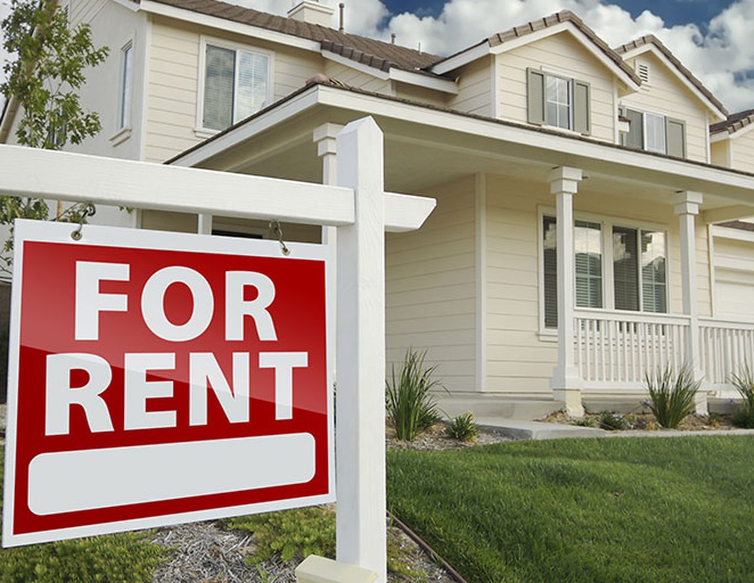 For Rent sign in front of a single-family investment property